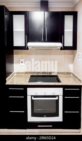 Whirlpool kitchen range, a stove built-in in modern kitchen solution Stock Photo