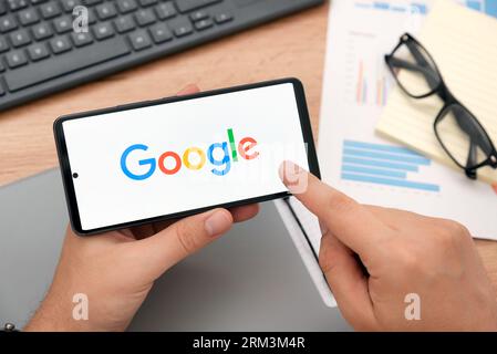 Wroclaw, Poland - AUG 24, 2023: Google logo on Samsung A53 screen. Google is most popular web search engine Stock Photo