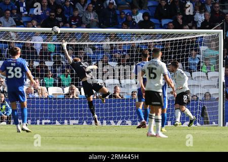 Cardiff, UK. 26th Aug, 2023. Jak Alnwick, the goalkeeper of Cardiff city makes a close range save to deny Josh Windass of Sheffield Wednesday (11). EFL Skybet championship match, Cardiff city v Sheffield Wednesday at the Cardiff City Stadium in Cardiff, Wales on Saturday 26th August 2023. this image may only be used for Editorial purposes. Editorial use only, pic by Andrew Orchard/Andrew Orchard sports photography/Alamy Live news Credit: Andrew Orchard sports photography/Alamy Live News Stock Photo