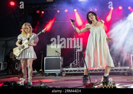 Leeds, UK. Saturday 26 August 2023 Guitarist Emily Roberts (L) and singer Abigail Morris of The Last Dinner Party perform at Leeds Festival 2023 in Bramham Park  © Jason Richardson / Alamy Live News Stock Photo