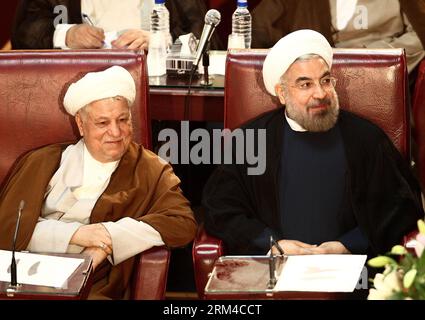 (130903) -- TEHRAN, Sept. 3, 2013 (Xinhua) -- Iranian President Hassan Rouhani (R) and Former President Akbar Hashemi-Rafsanjani attend a two-day official meeting of the Assembly of Experts in Tehran, capital of Iran, on Sept. 3, 2013. (Xinhua/Ahmad Halabisaz) IRAN-TEHRAN-ASSEMBLY OF EXPERTS-MEETING PUBLICATIONxNOTxINxCHN   130903 TEHRAN Sept 3 2013 XINHUA Iranian President Hassan Rouhani r and Former President Akbar Hashemi Rafsanjani attend a Two Day Official Meeting of The Assembly of Experts in TEHRAN Capital of Iran ON Sept 3 2013 XINHUA Ahmad Halabisaz Iran TEHRAN Assembly of Experts Mee Stock Photo