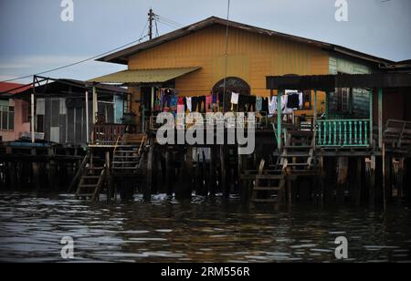 Bildnummer: 60576707  Datum: 07.10.2013  Copyright: imago/Xinhua Photo taken on Oct. 7, 2013 shows a house in Kampong Ayer, or the Water Village in Bandar Seri Begawan, in Brunei. All of the Water Village buildings are constructed on stilts above the Brunei River. Brunei is a sovereign state located on the north coast of the island of Borneo, in Southeast Asia. Apart from its coastline with the South China Sea, it is completely surrounded by the state of Sarawak, Malaysia; and it is separated into two parts by the Sarawak district Limbang. Brunei s population was 401,890 in July 2011. It has d Stock Photo