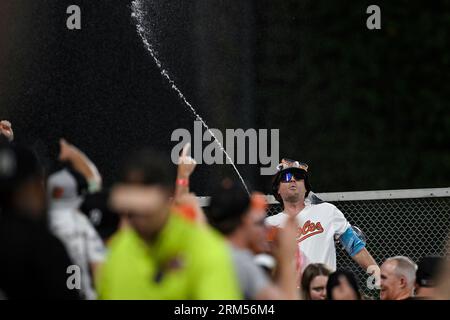 Mr. Splash sprays fans in the Bird Bath Splash Zone during the seventh  inning of a baseball game between the Baltimore Orioles and the Texas  Rangers, Friday, May 26, 2023, in Baltimore.