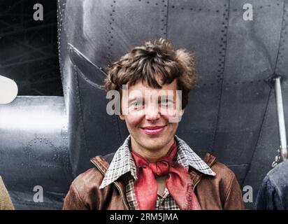 Amelia Earhart standing under nose of her Lockheed Model 10-E Electra. Gelatin silver print, 1937.  Photograph by Underwood & Underwood. Location: Cal Stock Photo