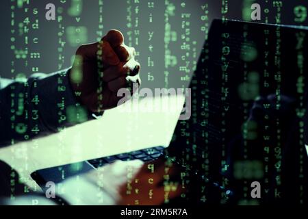 A male hacker who successfully makes a guts pose Stock Photo