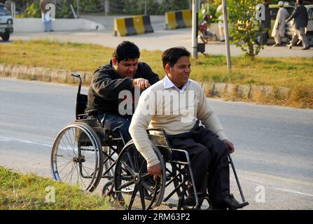Bildnummer: 60788749  Datum: 03.12.2013  Copyright: imago/Xinhua     (131203) -- ISLAMABAD, Dec. 3, 2013 (Xinhua) -- Disabled enjoy at a public park on the International Day of Persons with Disabilities in Islamabad, capital of Pakistan on Dec. 3, 2013. (Xinhua/Saadia Seher) PAKISTAN-ISLAMABAD-International Day of Persons with Disabilities PUBLICATIONxNOTxINxCHN Gesellschaft Behinderung Internationaler Tag der Menschen mit Behinderung xsp x1x 2013 quer Stock Photo