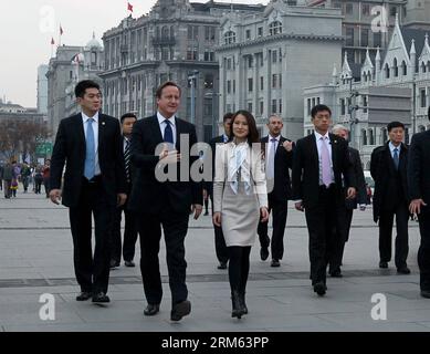 Bildnummer: 60788642  Datum: 03.12.2013  Copyright: imago/Xinhua     (131203) -- SHANGHAI, Dec. 3, 2013 (Xinhua) -- British Prime Minister David Cameron (front, L) visits the Bund area in east China s Shanghai, Dec. 3, 2013. (Xinhua/Chen Fei) (mt) CHINA-SHANGHAI-BRITISH PM-VISIT (CN) PUBLICATIONxNOTxINxCHN People Politik premiumd x0x xsk 2013 quer Stock Photo