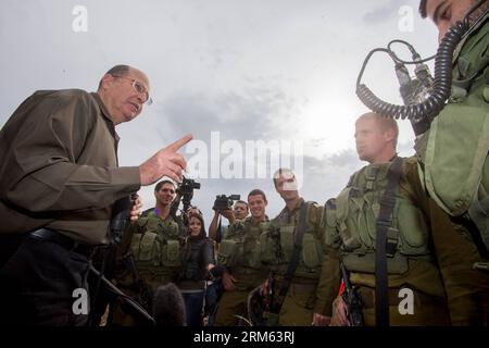 Bildnummer: 60789560  Datum: 03.12.2013  Copyright: imago/Xinhua     (131203) -- GOLAN HEIGHTS, Dec. 3, 2013 (Xinhua) -- Israeli Defense Minister Moshe Ya alon (1st L) inspects the Israeli Defense Forces (IDF) military base at the Golan Heights, on Dec. 3, 2013. Israeli Defense Minister Moshe Ya alon said Tuesday that Israel provides humanitarian assistance to Syrian citizens in villages near the border with the Jewish state, local media reported. (Xinhua/JINI) MIDEAST-GOLAN HEIGHTS-YA ALON-SYRIA PUBLICATIONxNOTxINxCHN People Politik Militär premiumd xsp x0x 2013 quer Stock Photo