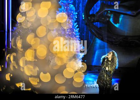 Bildnummer: 60794932  Datum: 04.12.2013  Copyright: imago/Xinhua     NEW YORK, Dec. 4, 2013 (Xinhua) -- British Singer Leona Lewis performs during the 81st Christmas Tree Lighting Ceremony in Rockefeller Center in New York City, the United States of America, Dec. 4, 2013. Thousands of filled on Wednesday streets around the Rockefeller Center to watch the moment when 45,000 multi-colored LED lights burst into color on the Christmas tree which is an approximately 12-ton, 76-foot tall, 75-year-old Norway spruce topped with a crystal star. (Xinhua/Zhang Ning) US-NEW YORK-ROCKEFELLER CENTER-CHRISTM Stock Photo