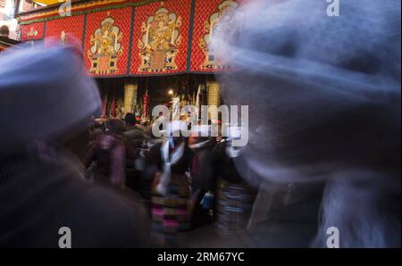 (131217) -- LHASA, Dec. 17, 2013 (Xinhua) -- People dance the Guozhuang, a bonfire dance of the Tibetan ethnic group, to celebrate the Palden Lhamo Festival at the Jokhang Temple in Lhasa, capital of southwest China s Tibet Autonomous Region, Dec. 17, 2013. The Palden Lhamo Festival, which falls on the 15th day of the 10th month of the Tibetan Calender, is celebrated by the female followers of Tibetan Buddhism to pray for a satisfactory marriage each year. (Xinhua/Purbu Zhaxi) (mt) CHINA-LHASA-PALDEN LHAMO FESTIVAL (CN) PUBLICATIONxNOTxINxCHN   Lhasa DEC 17 2013 XINHUA Celebrities Dance The Gu Stock Photo