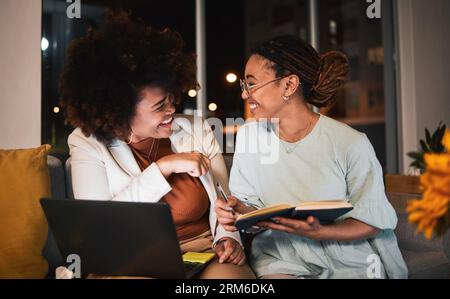 Women, friends and planning on laptop and notebook for creative idea, project or intern with funny research or teamwork. Working, together or happy Stock Photo