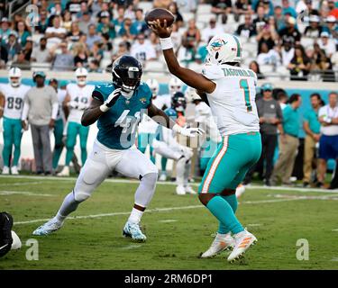 Jacksonville, United States. 26th Aug, 2023. Miami Quarterback Tua  Tagovailoa throws a short pass for a completion in the first quarter as the  Dolphins compete against the Jaguars in an NFL preseason