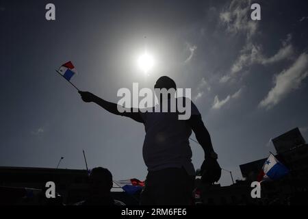 A man waves a Panamanian flag during the commemoration of the Martyrs Day, in Panama City, capital of Panama, on Jan. 9, 2014. The Martyrs Day was a movement occurred in Panama on Jan. 9, 1964, when troops of the U.S. Army clashed with high school students who demanded the right to raise the national flag in the area known as Canal Zone, a strip of land around the Panama Canal, which was ceded to the United States of America in perpetuity as a result of the Hay-Bunau-Varilla Treaty. (Xinhua/Mauricio Valenzuela) PANAMA-PANAMA CITY-MARTYRS DAY-COMMEMORATION PUBLICATIONxNOTxINxCHN   a Man Waves a Stock Photo