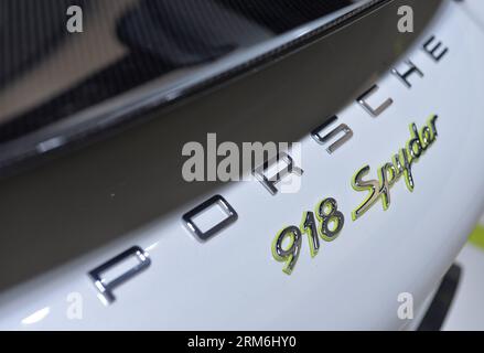 (140114) -- DETROIT, Jan. 14, 2014 (Xinhua) -- The Porsche 918 Spyder E-hybrid vehicle is presented during a press preview of the 2014 North American International Auto Show (NAIAS) in Detroit, the United States, Jan. 14, 2014. (Xinhua/Zhang Jun) US-DETROIT-AUTO SHOW-NAIAS PUBLICATIONxNOTxINxCHN   Detroit Jan 14 2014 XINHUA The Porsche 918 Spyder e Hybrid Vehicle IS presented during a Press Preview of The 2014 North American International Car Show NAIAS in Detroit The United States Jan 14 2014 XINHUA Zhang jun U.S. Detroit Car Show NAIAS PUBLICATIONxNOTxINxCHN Stock Photo