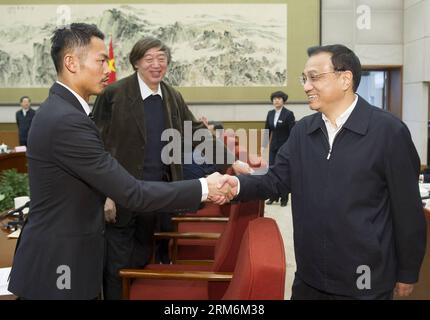 (140119) -- BEIJING, Jan. 19, 2014 (Xinhua) -- Chinese Premier Li Keqiang (R) shakes hands with badminton player Lin Dan before a forum in Beijing, capital of China, Jan. 17, 2014. Li listened to people from science, education, culture, medical and sports circles and the public at large while drafting a government work report at a forum held on Friday. A total of 10 representatives shared their views on the government s work in 2013 and made some suggestions to improve the report at the forum, according to a circular published on Sunday. (Xinhua/Huang Jingwen) (mt) CHINA-BEIJING-LI KEQIANG-GOV Stock Photo