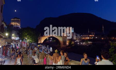 Mostar old Town and Unesco Site on a summers night full of tourists. with Stari Most (Old Bridge) behind. Bosnia and Herzegovina, August 26, 2023. Stock Photo