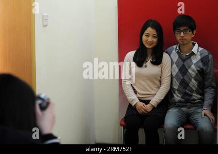 (140214) -- HANGZHOU, Feb. 14, 2014 (Xinhua) -- Newlyweds pose for marriage photos at a marriage registry on the Valentine s Day as well as the Chinese traditional Lantern Festival in Hangzhou, capital of east China s Zhejiang Province, Feb. 14, 2014. Many newlyweds chose to get marriage licenses on the Valentine s Day this year, as it coincides with the Lantern Festival, the 15th day of the first month of the Chinese lunar calendar. (Xinhua/Ju Huanzong) (lfj) CHINA-VALENTINE S DAY-MARRIAGE REGISTRATION (CN) PUBLICATIONxNOTxINxCHN   Hangzhou Feb 14 2014 XINHUA Newlyweds Pose for MARRIAGE Photo Stock Photo