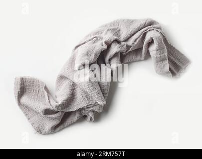 grey crumpled cotton napkin on white background, top view Stock Photo