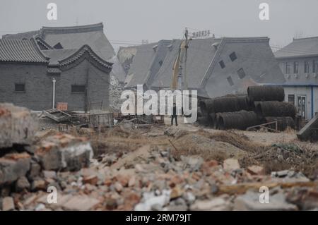 (140220) -- BEIJING, Feb. 20, 2014 (Xinhua) -- Illegal houses are demolished in Zhenggezhuang Village, Beiqijia Township of Changping District on the outskirt of Beijing, China, Feb. 20, 2014. Those illegal houses cover an area of 108.55 mu (about 7.24 hectares) , which will be used for tree planting after complete of demolition. (Xinhua/Luo Xiaoguang) (hdt) CHINA-BEIJING-CHANGPING-ILLEGAL HOUSES-DEMOLITION (CN) PUBLICATIONxNOTxINxCHN   Beijing Feb 20 2014 XINHUA illegal Houses are Demolished in  Village  Township of Chang Ping District ON The outskirts of Beijing China Feb 20 2014 Those illeg Stock Photo