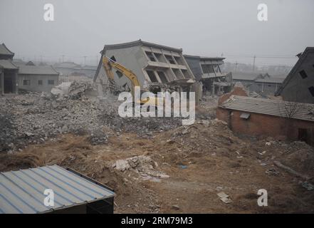 (140220) -- BEIJING, Feb. 20, 2014 (Xinhua) -- An excavator demolishes illegal houses in Zhenggezhuang Village, Beiqijia Township of Changping District on the outskirt of Beijing, China, Feb. 20, 2014. Those illegal houses cover an area of 108.55 mu (about 7.24 hectares) , which will be used for tree planting after complete of demolition. (Xinhua/Luo Xiaoguang) (hdt) CHINA-BEIJING-CHANGPING-ILLEGAL HOUSES-DEMOLITION (CN) PUBLICATIONxNOTxINxCHN   Beijing Feb 20 2014 XINHUA to excavator demolishes illegal Houses in  Village  Township of Chang Ping District ON The outskirts of Beijing China Feb 2 Stock Photo