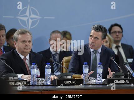 (140227) -- BRUSSELS, Feb. 27, 2014 (Xinhua) -- NATO Secretary General Anders Fogh Rasmussen (R, front) addresses the opening remarks as Ukraine s First Deputy Minister of Defense Oleksandr Oliynyk (L, front) listens at the meeting of NATO-Ukraine Commission during the 2-day NATO Defence Ministers Meeting at its headquarters in Brussels, capital of Belgium, Feb. 27, 2014. (Xinhua/Ye Pingfan) BELGIUM-BRUSSELS-NATO-DEFENCE MINISTERS MEETING-UKRAINE PUBLICATIONxNOTxINxCHN   Brussels Feb 27 2014 XINHUA NATO Secretary General Anders Fogh Rasmussen r Front addresses The Opening Remarks As Ukraine S Stock Photo