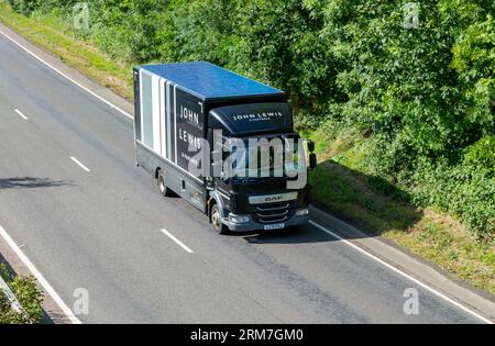 DAF delivery vehicle operated by John Lewis on A12 near Wickham Market, Suffolk, England, UL Stock Photo