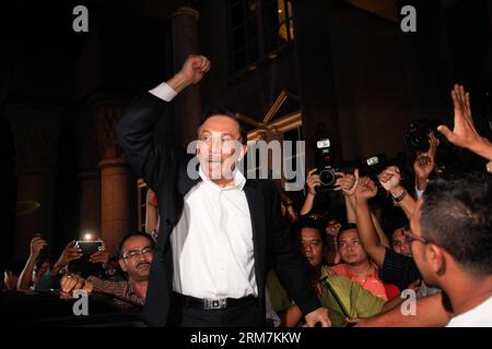 (140307) -- KUALA LUMPUR, March 7, 2014 (Xinhua) -- Malaysian opposition leader Anwar Ibrahim greets his supporters in Putrajaya, Malaysia, on March 7, 2014. Malaysian opposition leader Anwar Ibrahim on Friday was sentenced to five years imprisonment for sodomy in Putrajaya, which would threaten him from contesting in the Kajang by-election later this month. (Xinhua) MALAYSIA-KUALA LUMPUR-ANWAR PUBLICATIONxNOTxINxCHN   Kuala Lumpur March 7 2014 XINHUA Malaysian Opposition Leader Anwar Ibrahim greets His Supporters in Putrajaya Malaysia ON March 7 2014 Malaysian Opposition Leader Anwar Ibrahim Stock Photo