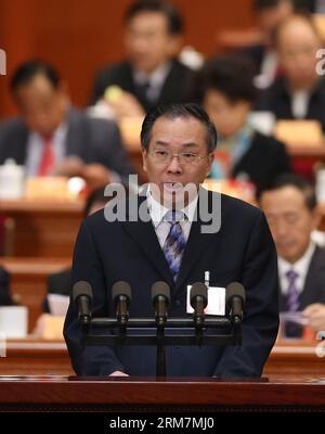 (140309) -- BEIJING, March 9, 2014 (Xinhua) -- Wang Guoqing, member of the 12th National Committee of the Chinese People s Political Consultative Conference (CPPCC), speaks at the fourth plenary meeting of the second session of the 12th National Committee of the CPPCC at the Great Hall of the People in Beijing, capital of China, March 9, 2014. (Xinhua/Lan Hongguang) (zkr) (TWO SESSIONS) CHINA-BEIJING-CPPCC-FOURTH PLENARY MEETING (CN) PUBLICATIONxNOTxINxCHN   Beijing March 9 2014 XINHUA Wang Guoqing member of The 12th National Committee of The Chinese Celebrities S Political Consultative Confer Stock Photo