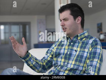 Owner of the Rimac Automobili electric vehicles company Mate Rimac talks to Xinhua correspondent during an interview at Rimac Automobili headquarters in Sveta Nedelja near Zagreb, Croatia, March 21, 2014. Rimac Automobili is a Croatian company that develops and produces high-performance electric vehicles, drivetrain and battery systems. Rimac Automobili s first model, the Concept One, is known as the world s fastest production electric vehicle. Recently, Rimac started cooperation with several Chinese companies. (Xinhua/Miso Lisanin)(bxq) CROATIA-ZAGREB-RIMAC ELECTRIC VEHICLES COMPANY PUBLICATI Stock Photo