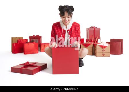 Happy young woman with many gifts Stock Photo