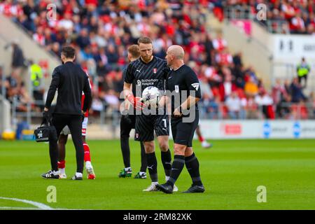 Referee Simon Hooper in discussion with Max Conway #25 of Bolton ...
