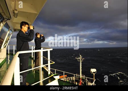 ABOARD XUELONG,   Crew members of Chinese icebreaker Xuelong scan the sea to search for missing Malaysia Airlines Flight MH370 on March 28, 2014. Chinese icebreaker Xuelong, or Snow Dragon, continued Friday its search for the missing Malaysia Airlines jet MH370, heading north to a new search area in the southern Indian Ocean designated by the Australian authorities. (Xinhua/Zhang Jiansong) (ctt) CHINA-ICEBREAKER-XUELONG-MISSING JET-MH370-SEARCH PUBLICATIONxNOTxINxCHN   Aboard XUELONG Crew Members of Chinese Icebreaker XUELONG Scan The Sea to Search for Missing Malaysia Airlines Flight  ON Marc Stock Photo