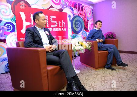 (140331) -- HANGZHOU,Nov. 16, 2013 (Xinhua) -- In this file photo taken on Nov. 16, 2013, Alibaba s CEO Jack Ma Yun (R) and Intime Retail Group Co. chairman Shen Guojun attend an event celebrating the 15th anniversary of Intime s department stores in Hangzhou, capital of east China s Zhejiang Province. Chinese e-commerce giant Alibaba Group announced on Monday that it will pay 5.3 billion Hong Kong dollars (692 million U.S. dollars) to acquire shares of Hong Kong-listed department store operator Intime (Yintai) Retail Group Co. Under the two companies agreement, Alibaba will acquire 9.9 percen Stock Photo