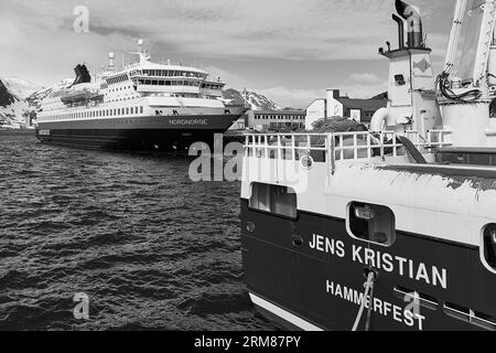 B&W Image Of The Norwegian Hurtigruten Ferry, MS NORDNORGE, Moored In The Small Fishing Community Of Honningsvåg, Norway. 6 May 2023 Stock Photo