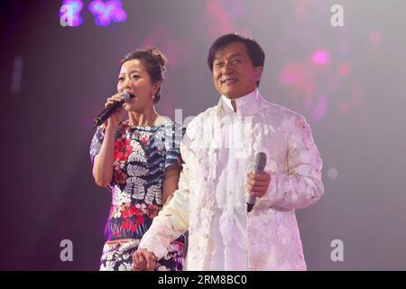 Action movie actor Jackie Chan (R) and South Korean actress Kim Hee Seon sing at a charity concert marking Jackie Chan s 60th birthday in Beijing, capital of China, April 6, 2014. (Xinhua) (lfj) CHINA-BEIJING-JACKIE CHAN-CHARITY CONCERT (CN) PUBLICATIONxNOTxINxCHN   Action Movie Actor Jackie Chan r and South Korean actress Kim Hee Seon Sing AT a Charity Concert marking Jackie Chan S 60th Birthday in Beijing Capital of China April 6 2014 XINHUA  China Beijing Jackie Chan Charity Concert CN PUBLICATIONxNOTxINxCHN Stock Photo