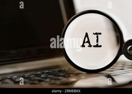 AI technology demonstrated with laptop, text and magnifying glass. Command Prompt and KI. Chat with artificial intelligence. Stock Photo