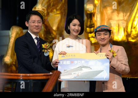 (140407) -- HONG KONG, April 7, 2014 (Xinhua) -- Actors Wong Cho Lam (R) and Li Ya nan (C) attend the sailing ceremony of the cruise ship SuperStar Virgo in Hong Kong, south China, April 7, 2014. Owned by the Singaporean company Star Cruises, the SuperStar Virgo set sail from a port in Hong Kong on Monday, marking the opening of its itinerary from Hong Kong to Kaohsiung of southeast China s Taiwan. (Xinhua/Qin Qing) (zgp) CHINA-HONG KONG-CRUISE-SAILING CEREMONY (CN) PUBLICATIONxNOTxINxCHN   Hong Kong April 7 2014 XINHUA Actors Wong Cho LAM r and left Ya Nan C attend The Sailing Ceremony of The Stock Photo