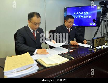 (140411) -- BEIJING, April 11, 2014 (Xinhua) -- Prosecutors prepare materials before the trail of Qin Zhijun, An alleged rumormonger, at the Chaoyang District People s Court in Beijing, capital of China, April 11, 2014. Qin Zhihui, known as Qinhuohuo in cyberspace, was accused of creating and spreading rumors about several Chinese celebrities including popular TV hostess Yang Lan, as well as China s former Ministry of Railways, via Sina Weibo, China s Twitter-like service, from December 2012 to August 2013, according to prosecutors. (Xinhua/Gong Lei) (lfj) CHINA-BEIJING-ALLEGED RUMORMONGER-TRI Stock Photo