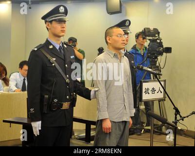 (140411) -- BEIJING, April 11, 2014 (Xinhua) -- Qin Zhijun, an alleged rumormonger, stood trial at the Chaoyang District People s Court in Beijing, capital of China, April 11, 2014. Qin Zhihui, known as Qinhuohuo in cyberspace, was accused of creating and spreading rumors about several Chinese celebrities including popular TV hostess Yang Lan, as well as China s former Ministry of Railways, via Sina Weibo, China s Twitter-like service, from December 2012 to August 2013, according to prosecutors. (Xinhua/Gong Lei) (lfj) CHINA-BEIJING-ALLEGED RUMORMONGER-TRIAL (CN) PUBLICATIONxNOTxINxCHN   Beiji Stock Photo