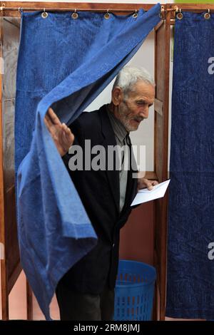 (140417) -- ALGIERS, April 17, 2014 (Xinhua) -- An Algerian man prepares to vote at a polling centre in Algiers on April 17, 2014. Algerian voters started casting ballots Thursday morning in the country s presidential election, which pits incumbent President Abdelaziz Bouteflika against former Prime Minister Ali Benflis and four other candidates. (Xinhua/Mohamed Kadri) (srb) ALGERIA-ALGIERS-ELECTION-VOTE PUBLICATIONxNOTxINxCHN   Algiers April 17 2014 XINHUA to Algerian Man Prepares to VOTE AT a Polling Centre in Algiers ON April 17 2014 Algerian Voters started Casting Ballots Thursday Morning Stock Photo