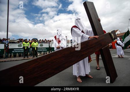 Locals participate in a procession to commemorate Good Friday, in Tunja, capital of Boyaca, Colombia, on April 18, 2014. (Xinhua/Jhon Paz) (rt) COLOMBIA-TUNJA-SOCIETY-HOLY WEEK PUBLICATIONxNOTxINxCHN   Locals participate in a Procession to commemorate Good Friday in Tunja Capital of Boyaca Colombia ON April 18 2014 XINHUA Jhon Paz RT Colombia Tunja Society Holy Week PUBLICATIONxNOTxINxCHN Stock Photo
