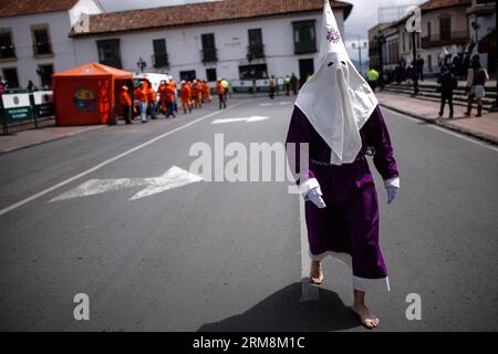 A local participates in a procession to commemorate Good Friday, in Tunja, capital of Boyaca, Colombia, on April 18, 2014. (Xinhua/Jhon Paz) (rt) COLOMBIA-TUNJA-SOCIETY-HOLY WEEK PUBLICATIONxNOTxINxCHN   a Local participates in a Procession to commemorate Good Friday in Tunja Capital of Boyaca Colombia ON April 18 2014 XINHUA Jhon Paz RT Colombia Tunja Society Holy Week PUBLICATIONxNOTxINxCHN Stock Photo