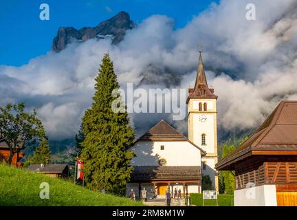 Grindelwald church with the Wetterhorn mountain behind, Bernese Alps, Grindelwald, Canton of Bern, Switzerland. Stock Photo