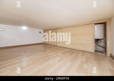 wooden sliding doors that cover a hole in a low-rise storage room Stock Photo