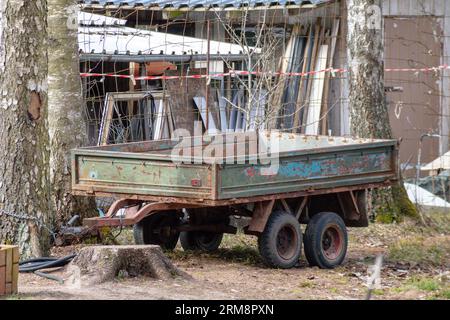 old tractor trailer in the forest Stock Photo