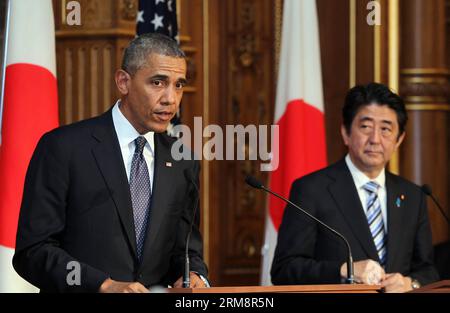 (140424) -- TOKYO, April 24, 2014 (Xinhua) -- U.S. President Barack Obama (L) attends a press conference with Japanese Prime Minister Shinzo Abe (R) at the Akasaka guesthouse in Tokyo on April 24, 2014. Visiting U.S. President Barack Obama and Japanese Prime Minister Shinzo Abe on Thursday vowed to enhance bilateral ties and agree to continue their talks on the U. S.-led Trans-Pacific Partnership (TPP) free trade talks. (Xinhua)(ctt) JAPAN-TOKYO-OBAMA PUBLICATIONxNOTxINxCHN   Tokyo April 24 2014 XINHUA U S President Barack Obama l Attends a Press Conference With Japanese Prime Ministers Shinzo Stock Photo