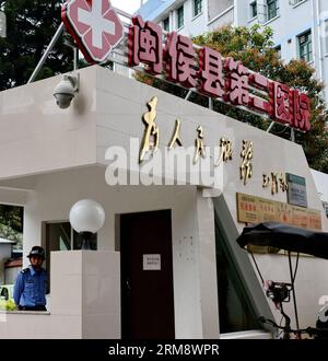 (140428) -- MINHOU, April 28, 2014 (Xinhua) -- A security guard stands at the entrance to the No. 2 People s Hospital of Minhou County, where injured pedestrians are treated, in Fuzhou, southeast China s Fujian Province, April 28, 2014. Six people were killed when a car hit a group of pedestrians in Fuzhou on Monday, local police said. And 13 others were injured. The victims were mostly from a nearby primary school and family members who had come to pick them up for lunch. The vehicle plowed into crowd before colliding with other cars for some two kilometers, before finally being stopped by po Stock Photo