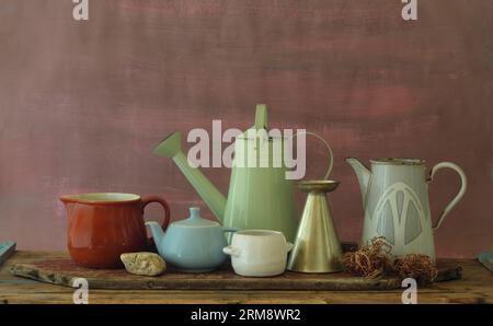 Vintage household objects and kitchen utensils,coffee pot,beaker,watering can and mug with free copy space Stock Photo