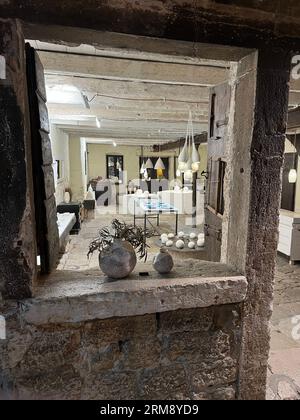 Rovinj, Croatia - July 9th 2022: View through a window into a shop selling artisanal pottery in this Istrian town on the Adriatic Sea Stock Photo