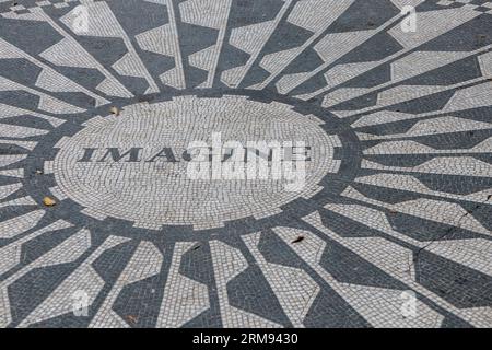 The caption 'Imagine' on the Strawberry Fields John Lennon memorial mosaic, Central Park, New York, USA Stock Photo